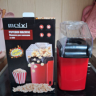 Product Description (WordPress Ready) Enjoy cinema-style popcorn in the comfort of your home with the Meixi A-209 Mini Popcorn Machine. Designed for health-conscious snackers, this compact powerhouse uses hot air technology instead of oil to deliver crunchy, fluffy popcorn in under 3 minutes. Key Features for Movie Night Healthy & Oil-Free: High-speed air circulation pops kernels without the need for butter or oil, making it a low-calorie snack perfect for any diet. Rapid Popping Speed: With 1200W of power, you can enjoy a fresh batch of popcorn in just 2.5 to 3 minutes—perfect for commercial breaks! High Efficiency Design: The advanced heating chamber ensures a 98% popping rate, minimizing unpopped kernels. Compact & Easy to Clean: Its small footprint makes it ideal for apartments, dorm rooms, or small kitchens. Simply wipe the interior with a damp cloth after use. Product Specifications Model: Meixi A-209 (Red/Black) Power: 1200W (Quartz Heating Element) Material: Food-grade, BPA-free plastic Bonus: Includes a built-in measuring cup that doubles as a butter melting tray.