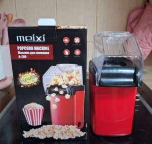 Product Description (WordPress Ready) Enjoy cinema-style popcorn in the comfort of your home with the Meixi A-209 Mini Popcorn Machine. Designed for health-conscious snackers, this compact powerhouse uses hot air technology instead of oil to deliver crunchy, fluffy popcorn in under 3 minutes. Key Features for Movie Night Healthy & Oil-Free: High-speed air circulation pops kernels without the need for butter or oil, making it a low-calorie snack perfect for any diet. Rapid Popping Speed: With 1200W of power, you can enjoy a fresh batch of popcorn in just 2.5 to 3 minutes—perfect for commercial breaks! High Efficiency Design: The advanced heating chamber ensures a 98% popping rate, minimizing unpopped kernels. Compact & Easy to Clean: Its small footprint makes it ideal for apartments, dorm rooms, or small kitchens. Simply wipe the interior with a damp cloth after use. Product Specifications Model: Meixi A-209 (Red/Black) Power: 1200W (Quartz Heating Element) Material: Food-grade, BPA-free plastic Bonus: Includes a built-in measuring cup that doubles as a butter melting tray.